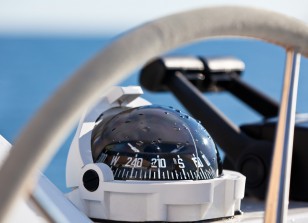 Sailing yacht control wheel and implement. Horizontal shot without people